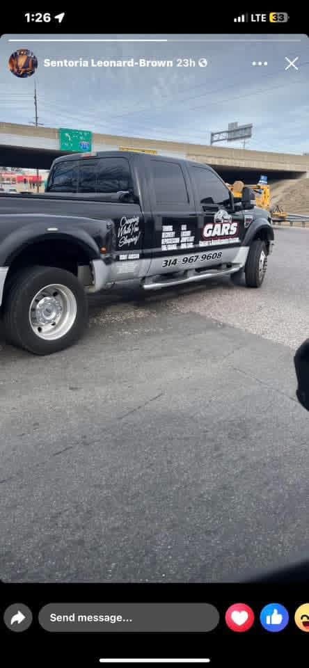 GARS tow truck parked under a St. Louis overpass
